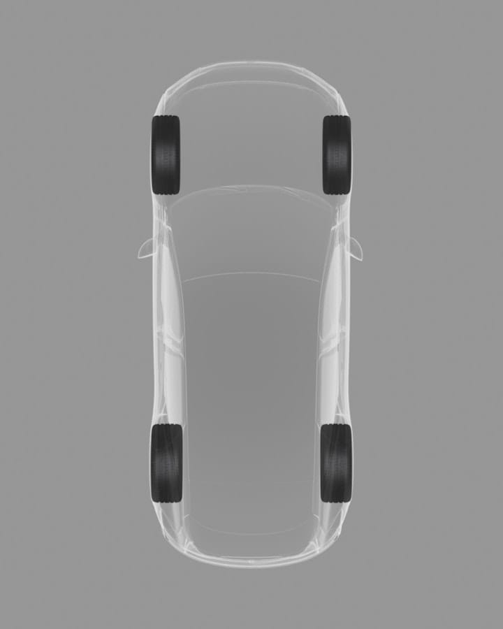 Top-down view of the car on a grey background showing a graphical, x-ray of the staggered stance of the wheels.